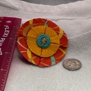 Vibrant Orange and Yellow Fabric Flower Brooch with Teal Button